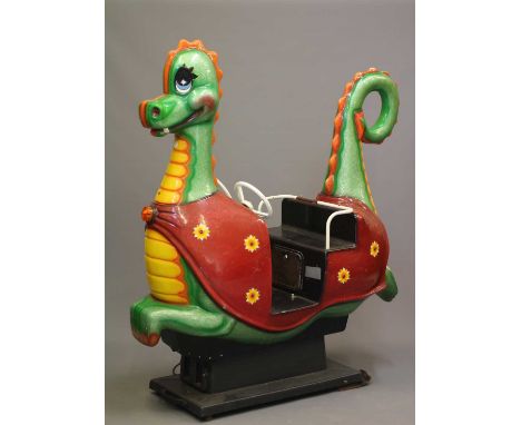 A Puff the Magic Dragon coin operated Whittaker Bros. kids ride, with 20p price, twin steering wheels and fibre glass constru