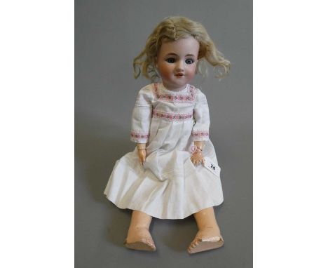 A Louis Lindner &amp; Sohne Halbig bisque socket head doll, with blue glass sleeping eyes, open mouth, teeth, pierced ears, b