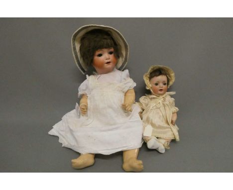 Two bisque socket head dolls, comprising a Schoenau &amp; Hoffmeister Hanna, with blue glass sleeping eyes, open mouth and te