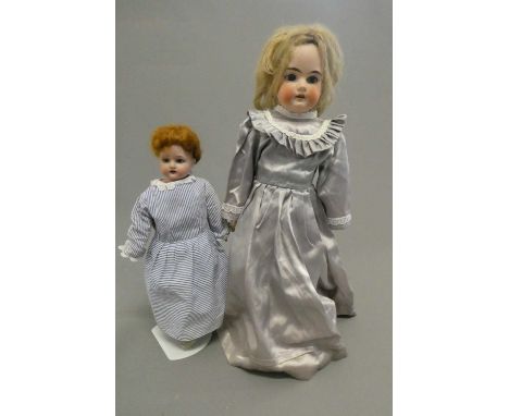 Two Armand Marseille bisque shoulder head dolls, comprising a 17 3/4" 370 with blue glass fixed eyes, open mouth, teeth, blon