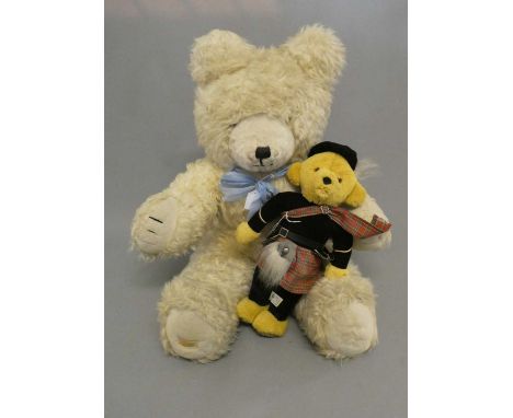 A large Wendy Boston teddy bear, with long white plush, sewn nose and amber eyes, 33 1/2" high, together with a small Merryth