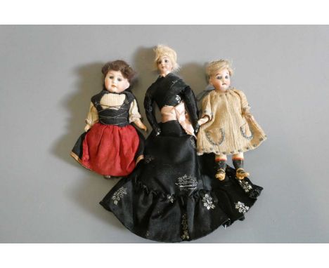 Three doll's house dolls, comprising one 6 3/4" lady with bisque head, brown glass fixed eyes, painted features, fabric body,