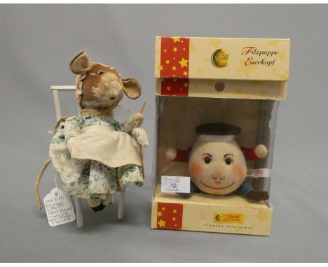 Two soft toys, comprising a boxed 9cm Steiff Humpty Dumpty "The Legend of Lewis Caroll" and a felt and silkwork doll on a cha