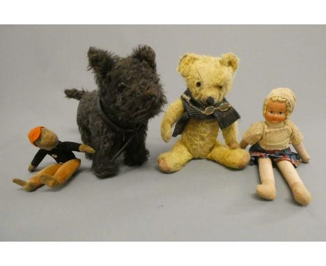 Four vintage soft toys, comprising a 13" Merrythought terrier with label, an 11 1/2" English teddy bear, a 7 3/4" Norah Welli