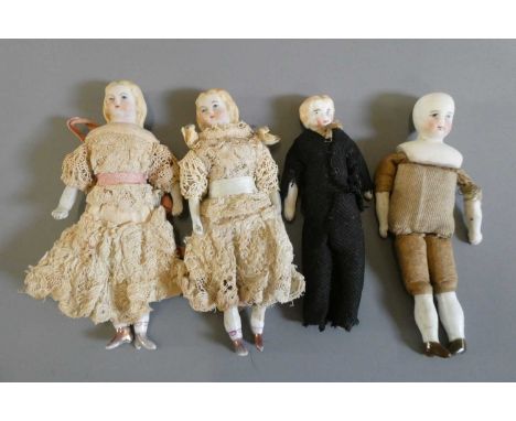 A pair of bisque shoulder head dolls with moulded and painted features, fabric bodies, bisque lower limbs and moulded and pai