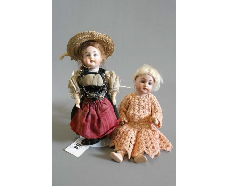 Two small SFBJ bisque socket head dolls, both with composition bodies and straight legs, one 8 1/4" long with brown glass fix