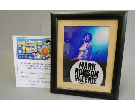 Signed photograph of Amy Winehouse, framed with Mark Ronson Valerie CD and with a "Picture This!" certificate (Est. plus 24% 