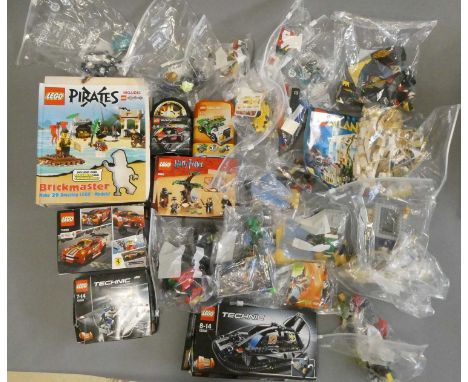 A large quantity of boxed and loose mixed Lego to include Atlantis 7985, Super Heroes 76004/6867/76036, Technic 42020/42002 a