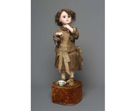 A Tete Jumeau bisque head automaton doll, c.1880, brown glass fixed eyes, closed mouth, pierced ears, bisque lower arms, comp