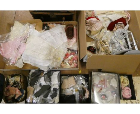 Two boxes of doll's clothing and accessories, together with doll stands and a trunk (Est. plus 24% buyer's premium inc. VAT)C