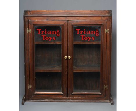 Triang Toys display cabinet of wood construction, dark brown varnish finish with glass wooden framed doors, two inside shelve