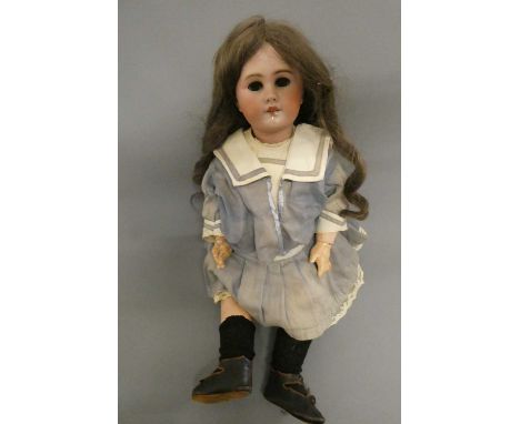 A Bebe Jumeau bisque socket head doll, with brown glass sleeping eyes, open mouth, teeth, pierced ears, wood and composition 