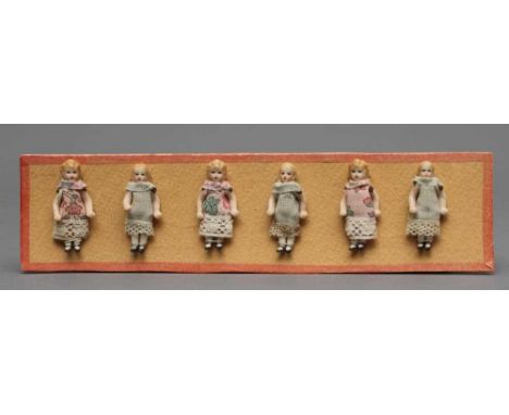Six Hertwig &amp; Co. all bisque doll's house dolls with moulded and painted features, jointed shoulders and hips, moulded an