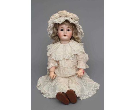 A rare French "Mon Tresor" bisque socket head doll with brown glass fixed eyes, open mouth, pierced ears, blond wig, wood and