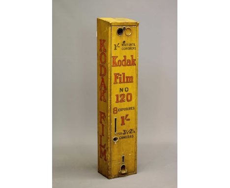 A Kodak film dispenser, 1940s, of metal construction painted yellow with red script, priced at 1/-, 9 1/8" x 43", with key, s