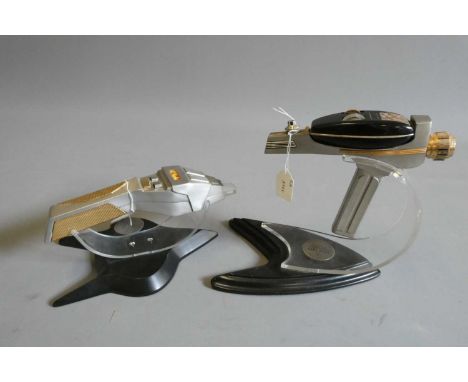 Star Trek - two Franklin Mint 30th anniversary phasers on stands, one with clear tip missing and small crack to read-out, lab