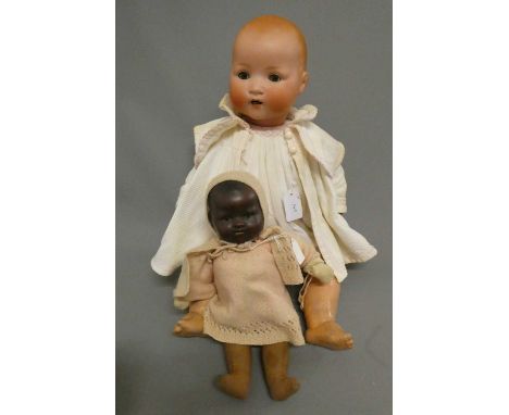 Two Armand Marseille bisque baby dolls, comprising a 23 1/2" 241-7 with sleeping eyes and open mouth, and a 13 1/2" flange ne