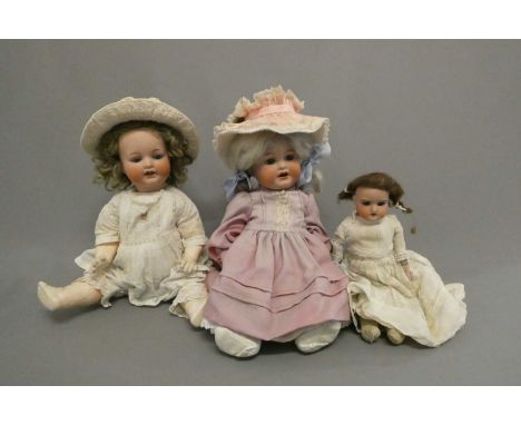 Three Armand Marseille bisque head dolls, comprising an 18 1/2" 996 7 socket head character doll, with blue glass eyes and op