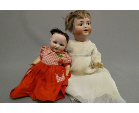 Two bisque socket head dolls, comprising a Simon Halbig K&amp;R flirty eyed doll, with sleeping lids, open mouth, teeth, tong