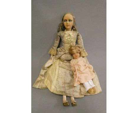 Two vintage felt head dolls, comprising a 30" fashion doll with painted sideways glancing eyes, fabric body and ballgown, and