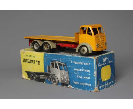 Shackleton clockwork Foden flat bed lorry finished in yellow with key, spanner and instructions, tested in working order with