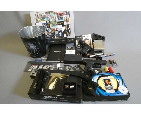James Bond collectors ephemera including Sony Ericsson K800i phone, replica guns, pin badges, playing cards, puzzle and champ