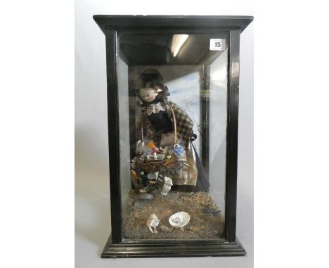 A cased haberdashery saleswoman peg doll, 14" doll with carved and painted features, sales basket filled with doll's house it
