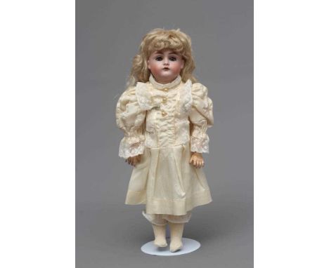 A J. D. Kestner bisque socket head doll, with blue glass sleeping eyes, open mouth, applied teeth, blond wig, wood and compos