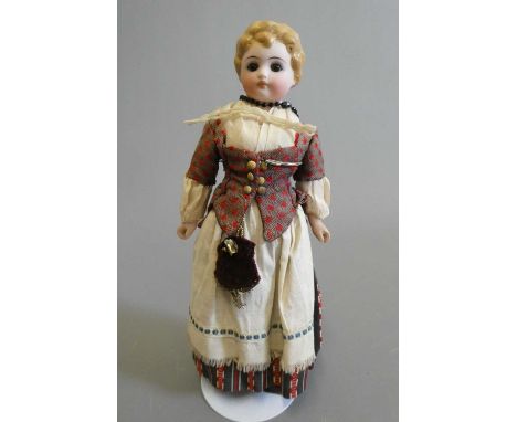 A bisque shoulder head doll, with brown glass fixed eyes, closed mouth, moulded blond hair, fabric body and bisque lower arms