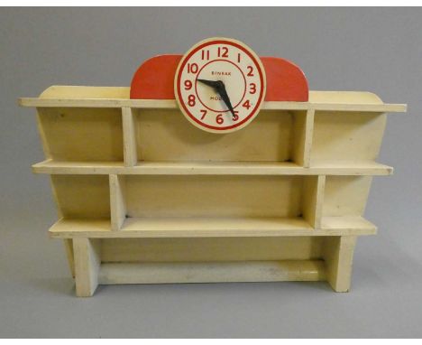 Binbak Models wooden toy car display stand with clock motif, finished in red and cream, good (Est. plus 24% buyer's premium i
