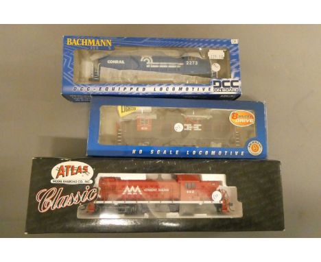 Three American H0 scale diesel locomotive by Bachmann and Atlas comprising New Haven Lines, Vermont Railway and Conrail, all 