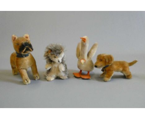 Four Steiff animals, comprising a goose, a hedgehog, a dog and Bazi (Est. plus 24% buyer's premium inc. VAT)Condition Report: