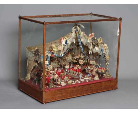 An antique glazed case sale stall diorama, containing a miriad of objects including doll's house furniture and accessories, s