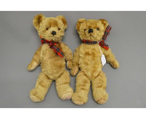 Twin Farnell teddy bears, with sewn noses, amber glass eyes, fabric pads and one with maker's label to foot, both 16" (Est. p