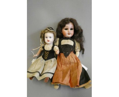 Two bisque socket head dolls, comprising a 7 3/4" SFBJ 60 13/0 doll with painted features, composition straight leg body and 