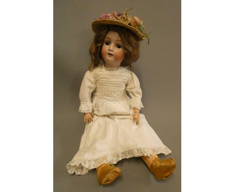 An Alt, Beck &amp; Gottschalk bisque socket head doll, with brown glass sleeping eyes, open mouth, applied teeth, pierced ear