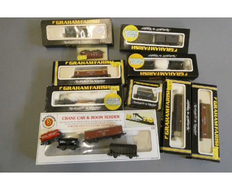 N gauge goods rolling stock by Graham Farish and others including coal trucks, covered vans and crane, some items boxed, fair