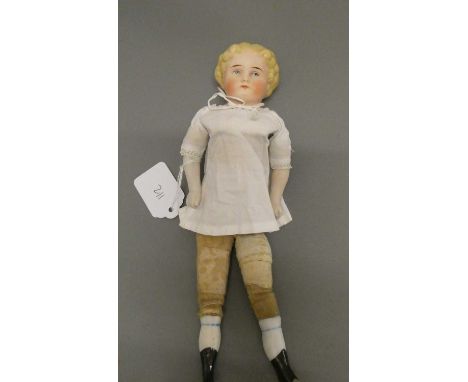 An antique bisque shoulder head doll, with moulded hair, painted features, bisque lower limbs and fabric body, numbered 772 3