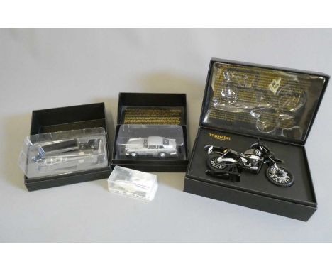 Four James Bond vehicles comprising Air launched glider, Aston Martin DB 5 with bullets, Motif Triumph scramble motorcycle an