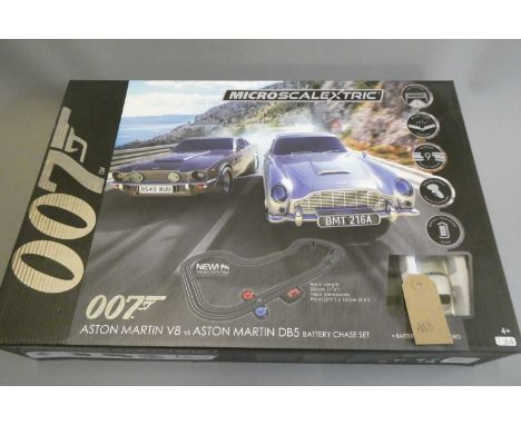 James Bond Micro Scalextric race set with Aston Martin BB5 and Aston Martin V8, boxed, excellent to mint (Est. plus 24% buyer