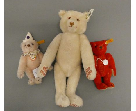 Three Steiff teddy bears, comprising a 12 1/2" white bear, a 6 3/4" red bear and a 7 3/4" teddy clown (Est. plus 24% buyer's 