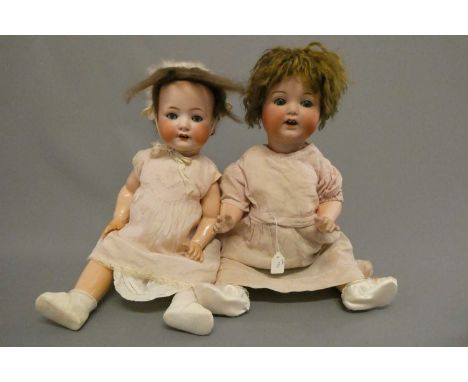 Two bisque socket head character dolls, comprising a 21" Armand Marseille 996 12 doll, with blue glass sleeping eyes and trem