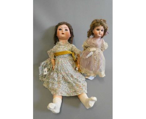 Three bisque socket head dolls, comprising a 23" Schoenau &amp; Hoffmeister 1909 6 1/2 with blue glass sleeping eyes, open mo