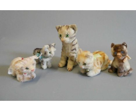 Five Steiff cats, most vintage and four with ear buttons, largest 6 3/8" tall (Est. plus 24% buyer's premium inc. VAT)Conditi