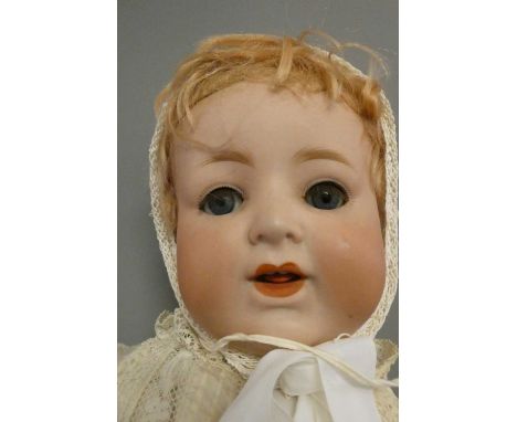 Two German bisque socket head dolls, comprising a 21 1/4" JWG(?) 9 3/4, with blue glass sleeping eyes, open mouth, hinged ton
