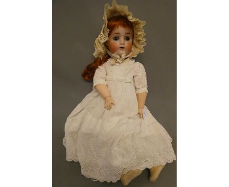 An Alt Beck &amp; Gottschalk bisque socket head doll, with brown glass sleeping eyes, open mouth, pierced ears, auburn wig, w