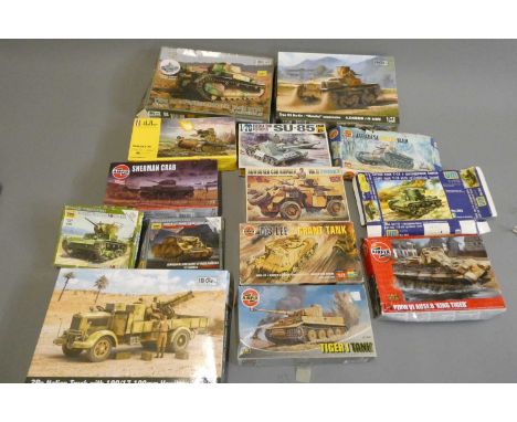 Fourteen plastic construction kits of tanks and armoured vehicles by Airfix and others, majority are 1:72 scale, boxed in pla