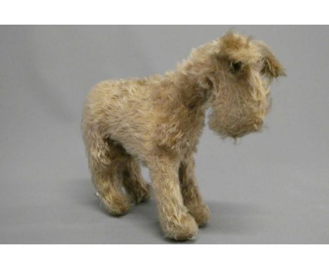A vintage Chad Valley dog, with blond plush and amber eyes, 13" long (Est. plus 24% buyer's premium inc. VAT)Condition Report