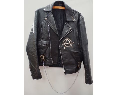 Vintage Fashion - A black leather jacket embellished with studs, chains, safety pins and Sex Pistols 'God Save The Queen' fab