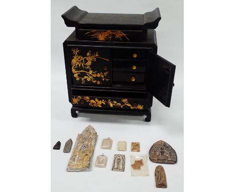 Thailand and Vietnam - A black lacquered table cabinet with gilt painted decoration, comprising of two drawers beneath two cu